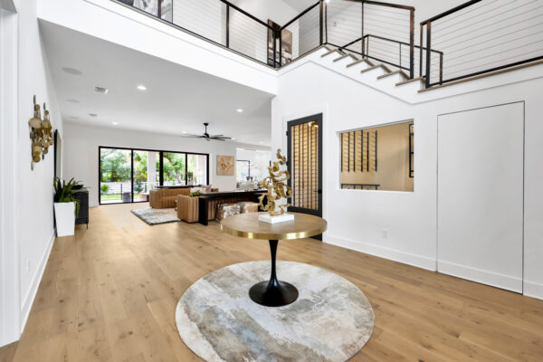 a room with a table and a staircase